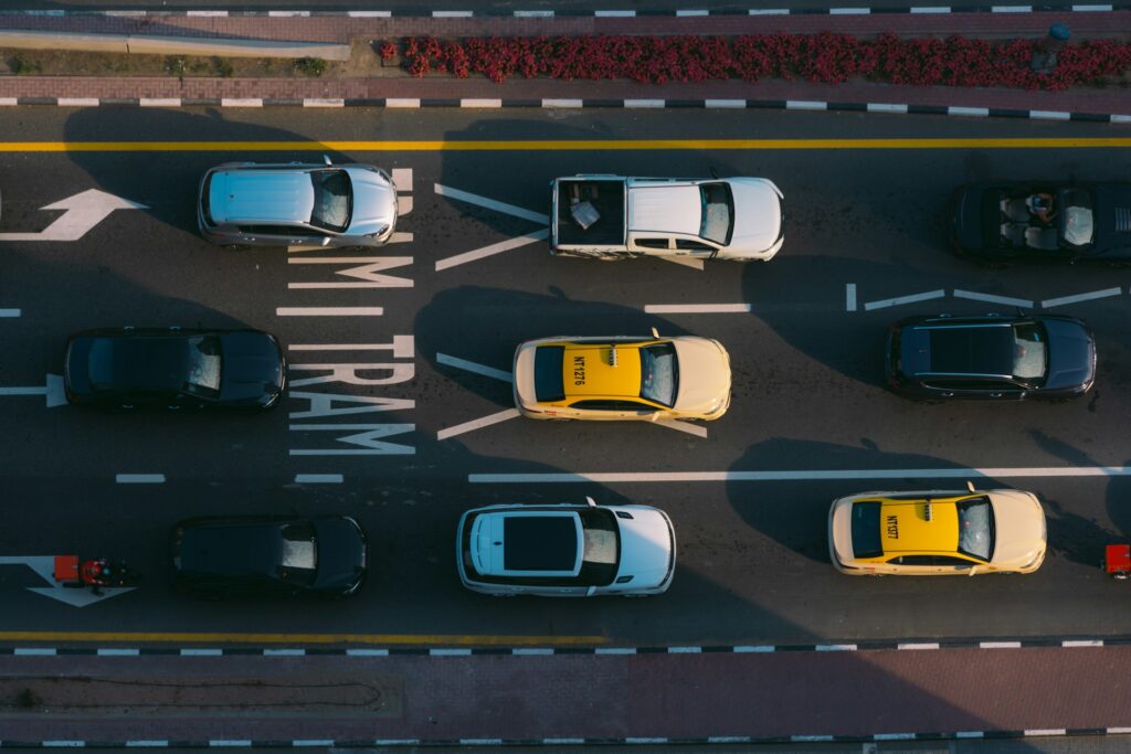 Electric vehicle driving in traffic and varying road conditions affecting EV performance