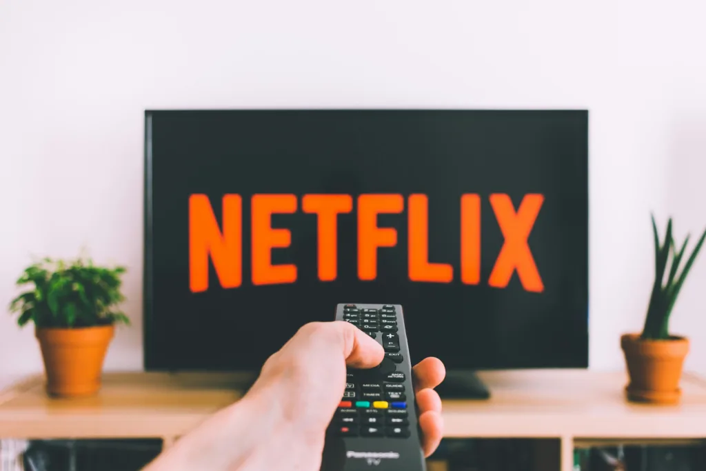 Netflix app search screen showing Ask button for AI voice search feature